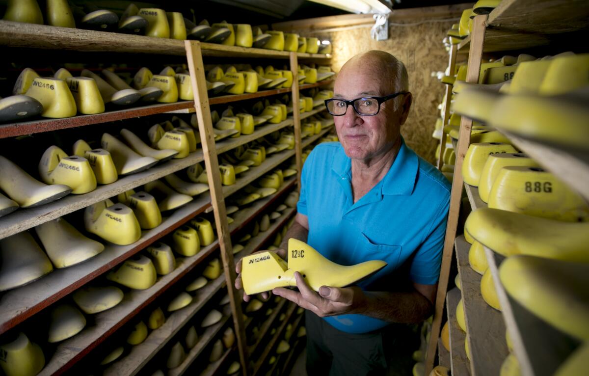 Randy Merrell stands among shoe lasts at his workshop, Merrell FootLab, on Sunday, Sept. 22, 2019, just outside of Vernal, Utah.