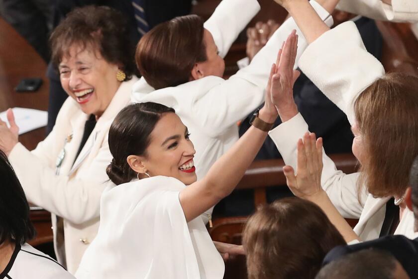 WASHINGTON, DC - FEBRUARY 05: Rep. Alexandria Ocasio-Cortez (D-NY) and other female lawmakers cheer during President Donald Trump's State of the Union address in the chamber of the U.S. House of Representatives at the U.S. Capitol Building on February 5, 2019 in Washington, DC. A group of female Democratic lawmakers chose to wear white to the speech in solidarity with women and a nod to the suffragette movement. (Photo by Win McNamee/Getty Images) ** OUTS - ELSENT, FPG, CM - OUTS * NM, PH, VA if sourced by CT, LA or MoD **