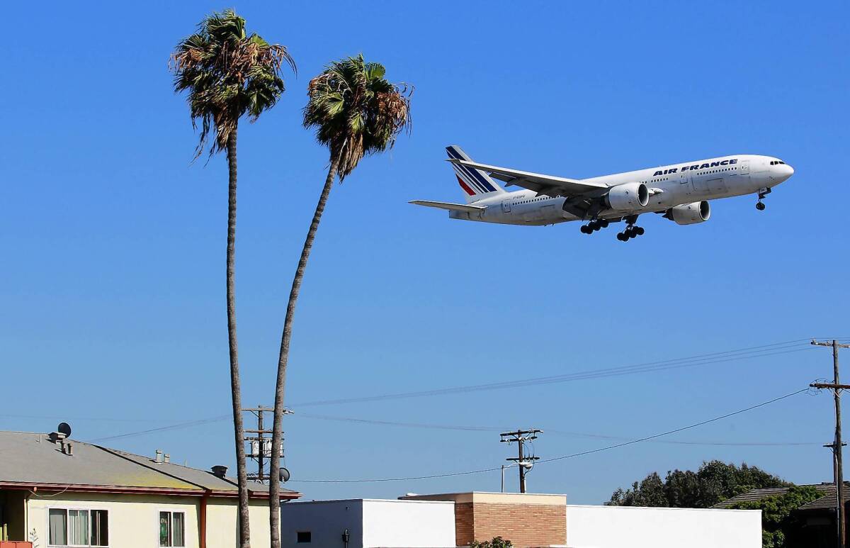 A plane heads toward one of the northern runways at LAX. A coalition of business and labor groups wants to increase the distance between the facility's two northern runways to more easily accommodate the largest commercial airliners, such as the giant Airbus A380. Neighborhood groups, however, say the project would degrade surrounding residential and commercial areas.