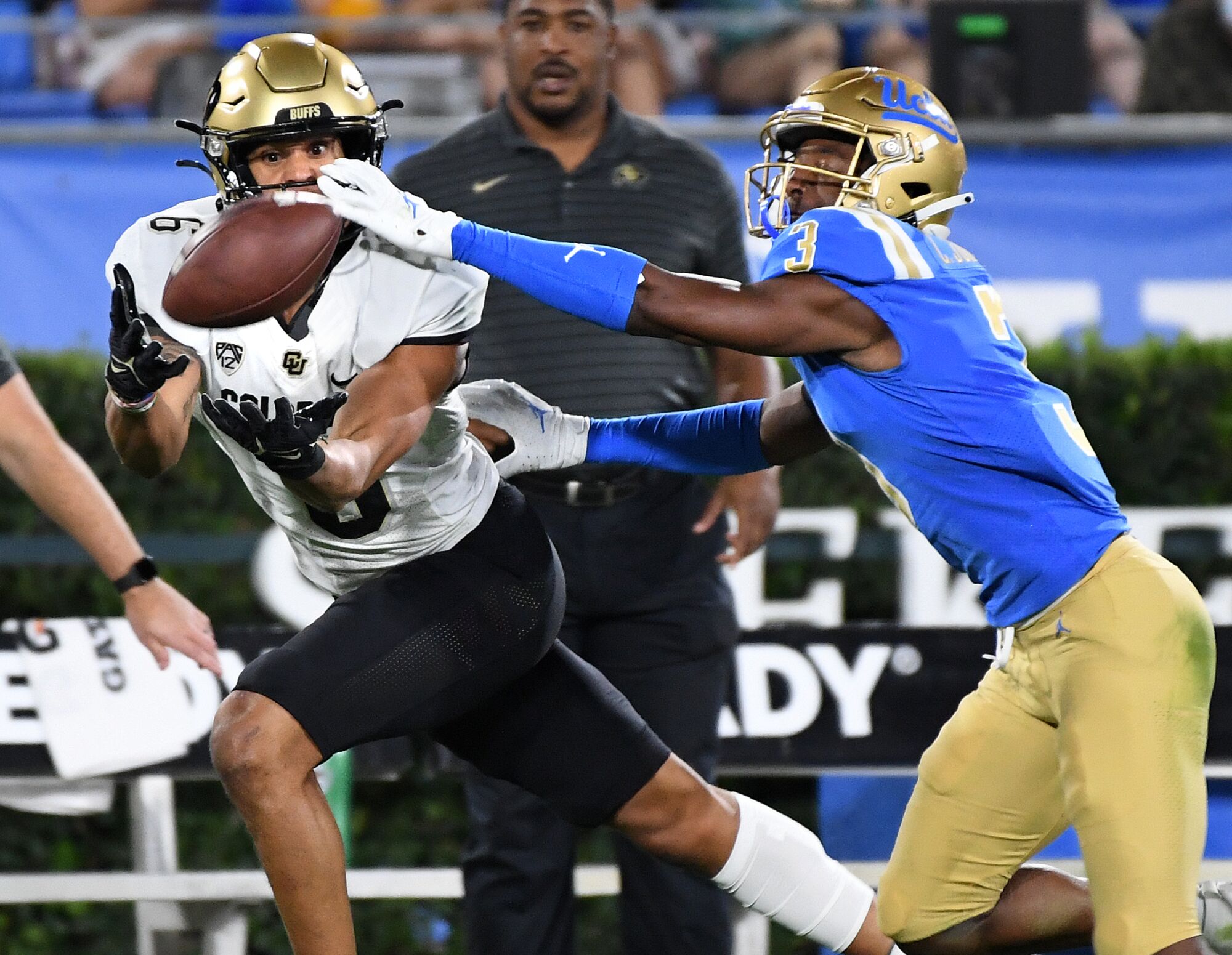  Colorado receiver La'Vontae Shenault hauls in a long pass in front of UCLA defensive back Cameron Johnson.
