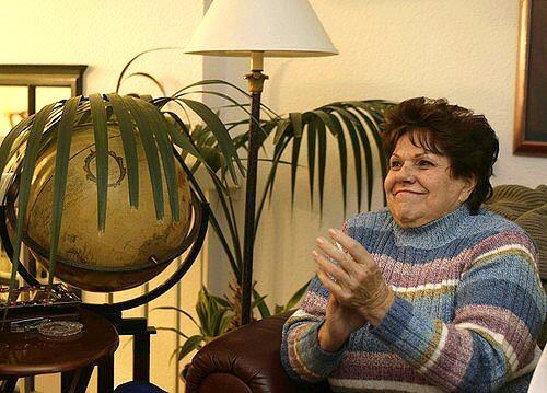 June Linn claps at the family's home in Newport Beach, Calif., as she learns that her son, Ken Barnes Jr., the Southern California sailor adrift at sea off the coast of Chile, has been rescued by a Chilean fishing vessel.