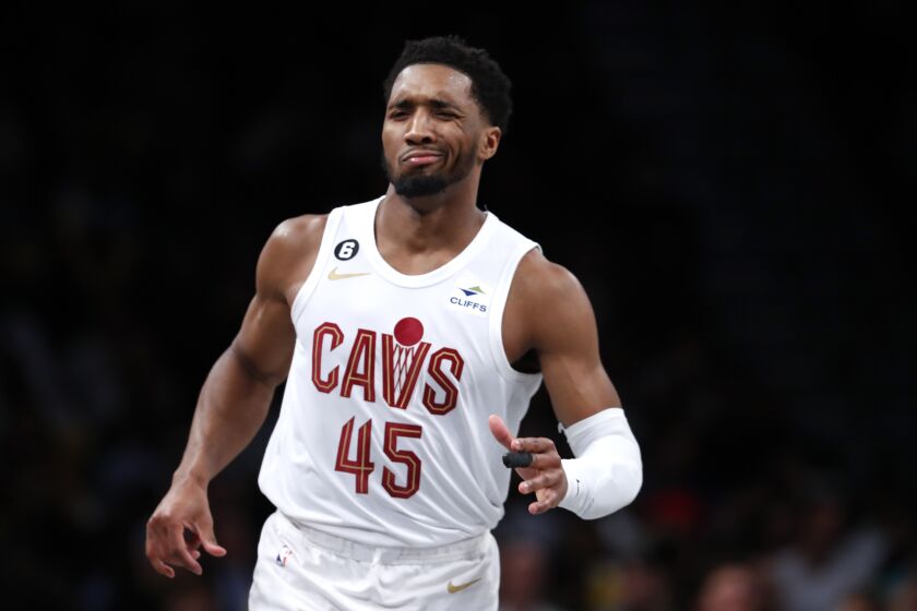 Cleveland Cavaliers guard Donovan Mitchell (45) reacts after making a three point shot against the Brooklyn Nets during the second half of an NBA basketball game, Tuesday, March 21, 2023, in New York. The Cleveland Cavaliers won 115-109. (AP Photo/Noah K. Murray)