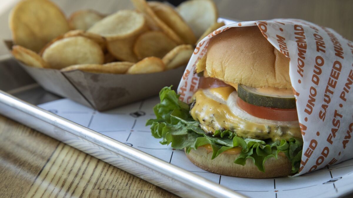 One of Jonathan Cheban's contributions to the menu at BurgerIM: a full-size cheeseburger.