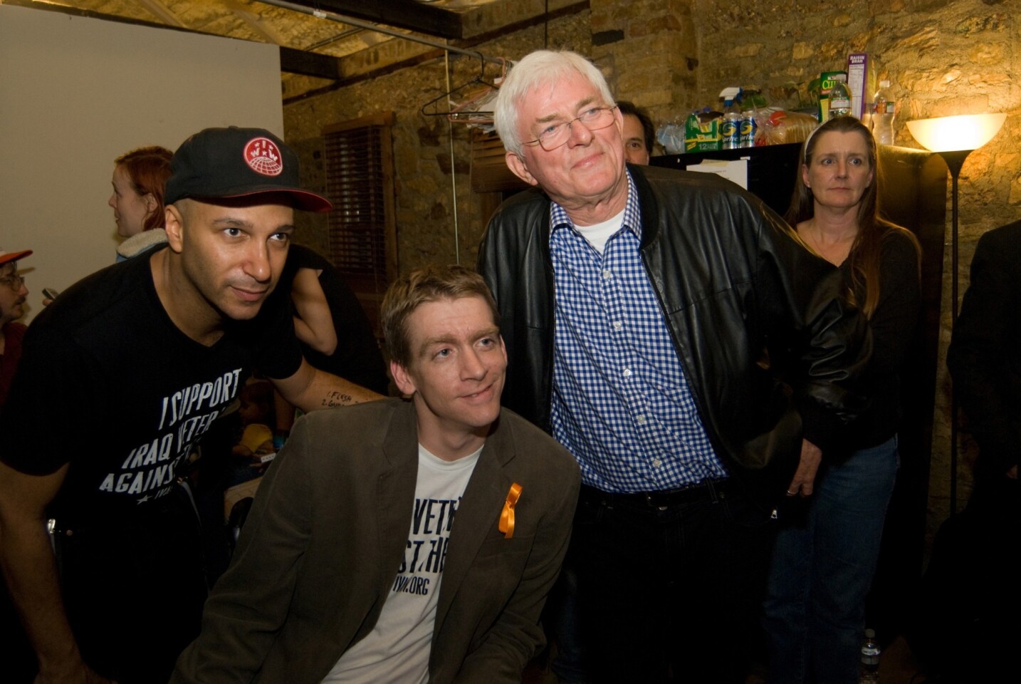 Musician Tom Morello, left, and Phil Donahue flank Tomas Young. Donahue produced and directed a documentary about Young with Ellen Spiro.