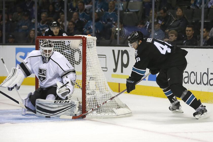 Kings goalie Jhonas Enroth blocks a shot by Sharks center Tomas Hertl in the third period Thursday night in San Jose.