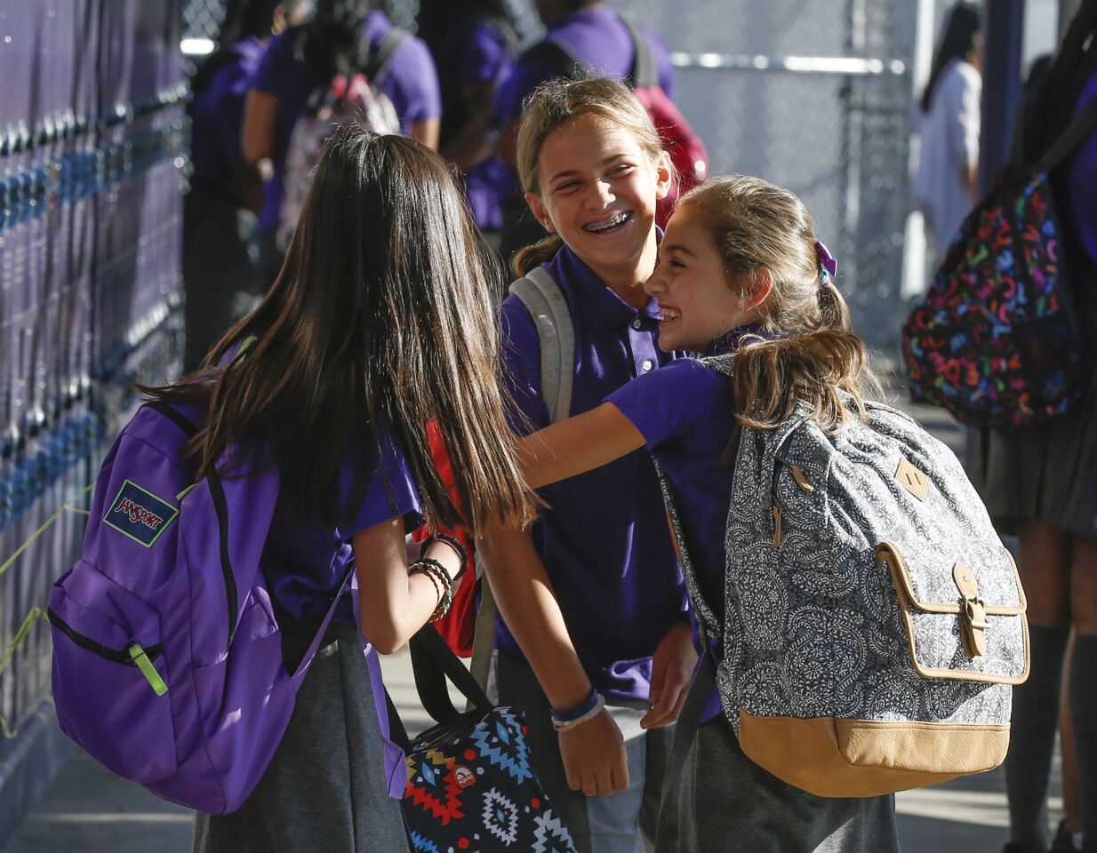 Alexis Escuadro, left, Delia Mizrahi and Leila Shiva greet one another at the academy.