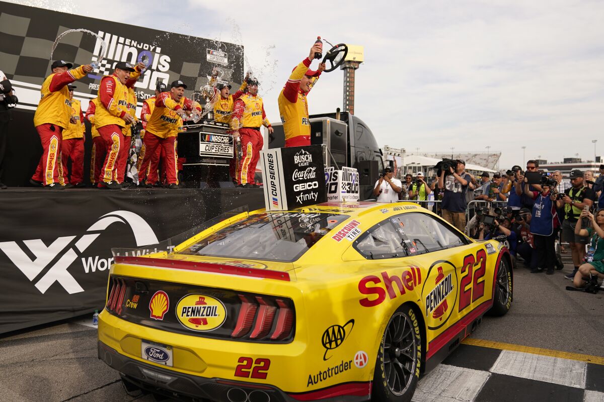 Joey Logano celebrates after winning a NASCAR Cup Series auto race at World Wide Technology Raceway, Sunday, June 5, 2022, in Madison, Ill. (AP Photo/Jeff Roberson)