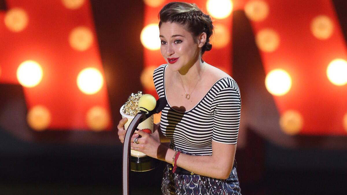Shailene Woodley accepts the best female performance award at the MTV Movie Awards.