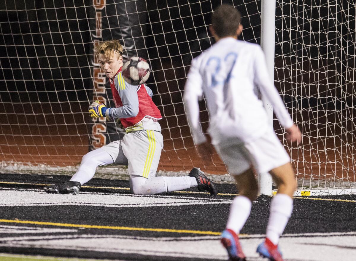 Corona del Mar's Nik Darrough makes one of nine saves against Los Alamitos during the Surf League second-place tiebreaker match on Thursday.