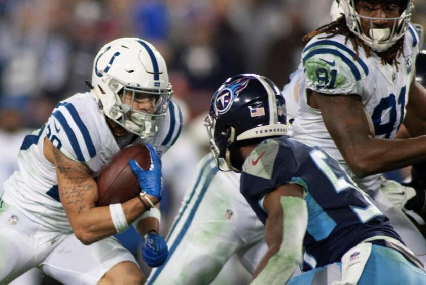 Indianapolis Colts running back Jordan Wilkins (L) carries the ball during the NFL game between the Tennessee Titans and the Indianapolis Colts at Nissan Stadium in Nashville, Tennessee, USA, 30 December 2018. EFE-EPA/RICK MUSACCHIO