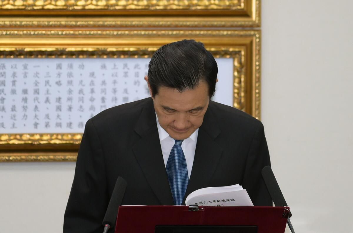 President Ma Ying-jeou bows as he resigns as chairman of Taiwan's ruling party on Dec. 3.