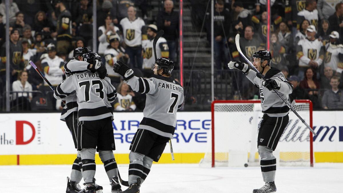 Kings right wing Tyler Toffoli (73) is congratulated by teammates after scoring the game-winning goal in overtime against the Vegas Golden Knights on Dec. 23, 2018, in Las Vegas.