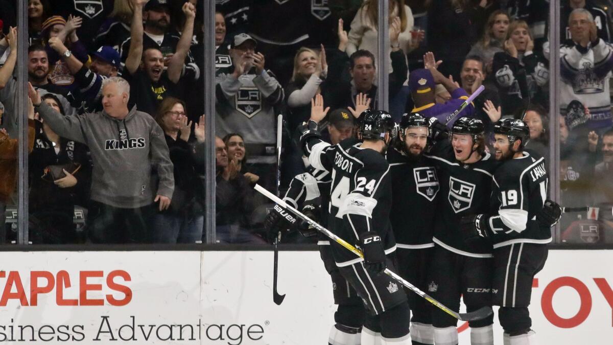 Members of the Kings celebrate after a goal by center Tyler Toffoli during the first period against the Florida Panthers in Los Angeles.