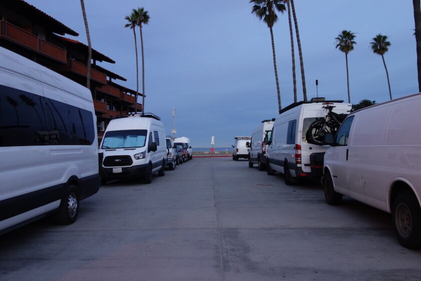 Vans parked along Vallecitos in La Jolla Shores one January morning, with "vanlifers" believed to be inside.