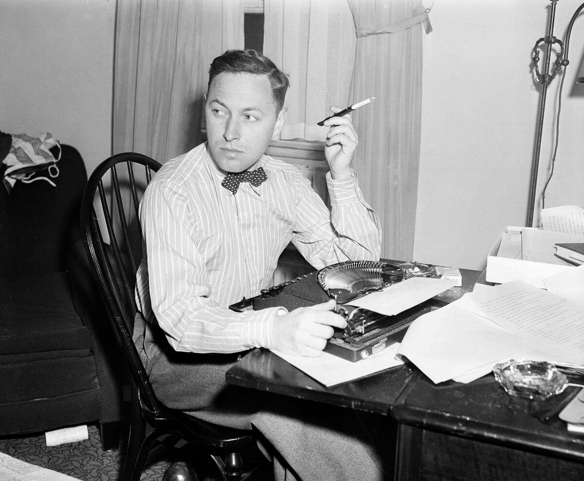 FILE - This Nov. 11, 1940 file photo shows playwright Tennessee Williams at his typewriter in New York. A rarely seen Williams short story “The Summer Woman” appears in the fall issue of the literary quarterly The Strand Magazine. (AP Photo/Dan Grossi, File)