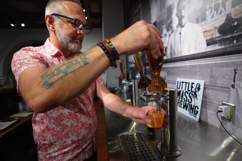 San Diego, CA - July 08: At Balboa Park on Saturday, July 8, 2023 in San Diego, CA., Beer Docent Steve Keeley from Taste San Diego poured a blonde ale sample. Taste San Diego is located in the San Diego History Center Balboa Park. (Nelvin C. Cepeda / The San Diego Union-Tribune)