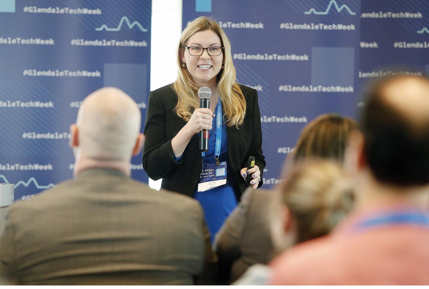 Molly Beck, of Messy.fm, pitches a line of judges about her company for PitchFest, part of Glendale's 2018 Tech Week at CBRE in Glendale on Thursday, September 20, 2018. PitchFest is a Shark Tank-like opportunity for companies to pitch their business ideas to a panel, with the hopes of taking home a $60,000 prize.