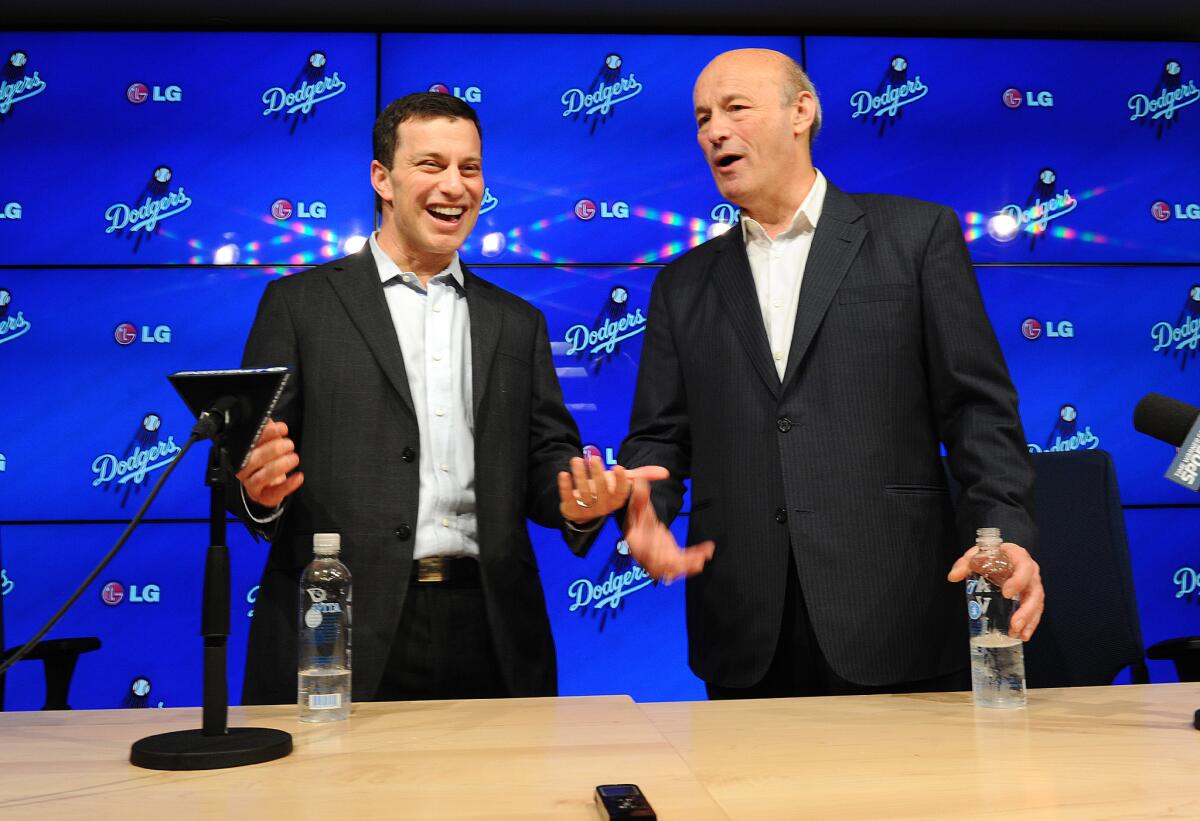 Andrew Friedman, left, and Stan Kasten are just two of the many former general managers in the Dodgers' front office these days.
