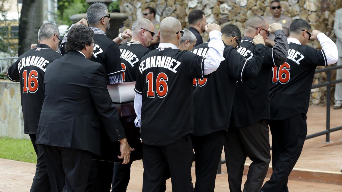 Pallbearers wear No. 16 jerseys in honor of Miami Marlins pitcher Jose Fernandez as they carry his casket Thursday.