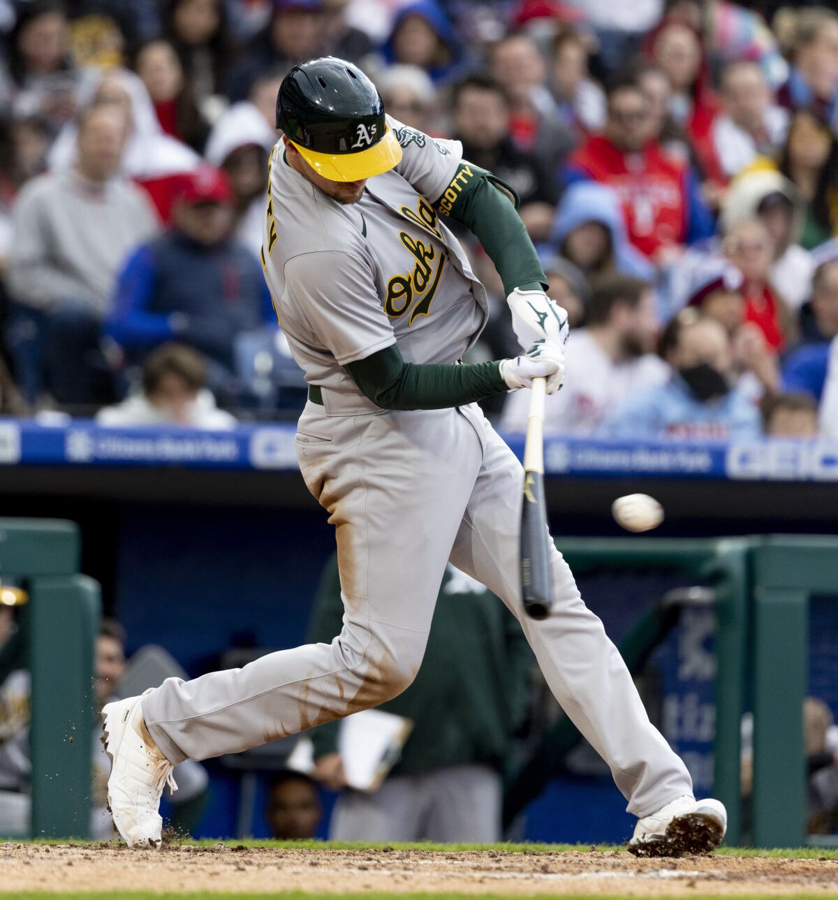 Oakland Athletics' Stephen Piscotty (25) hits an RBI single during the eighth inning of a baseball game against the Philadelphia Phillies, Saturday, April 9, 2022, in Philadelphia. (AP Photo/Laurence Kesterson)