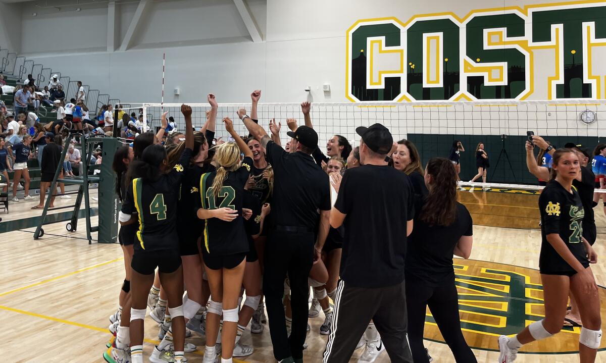 Mira Costa girls' volleyball celebrates after an early season win.