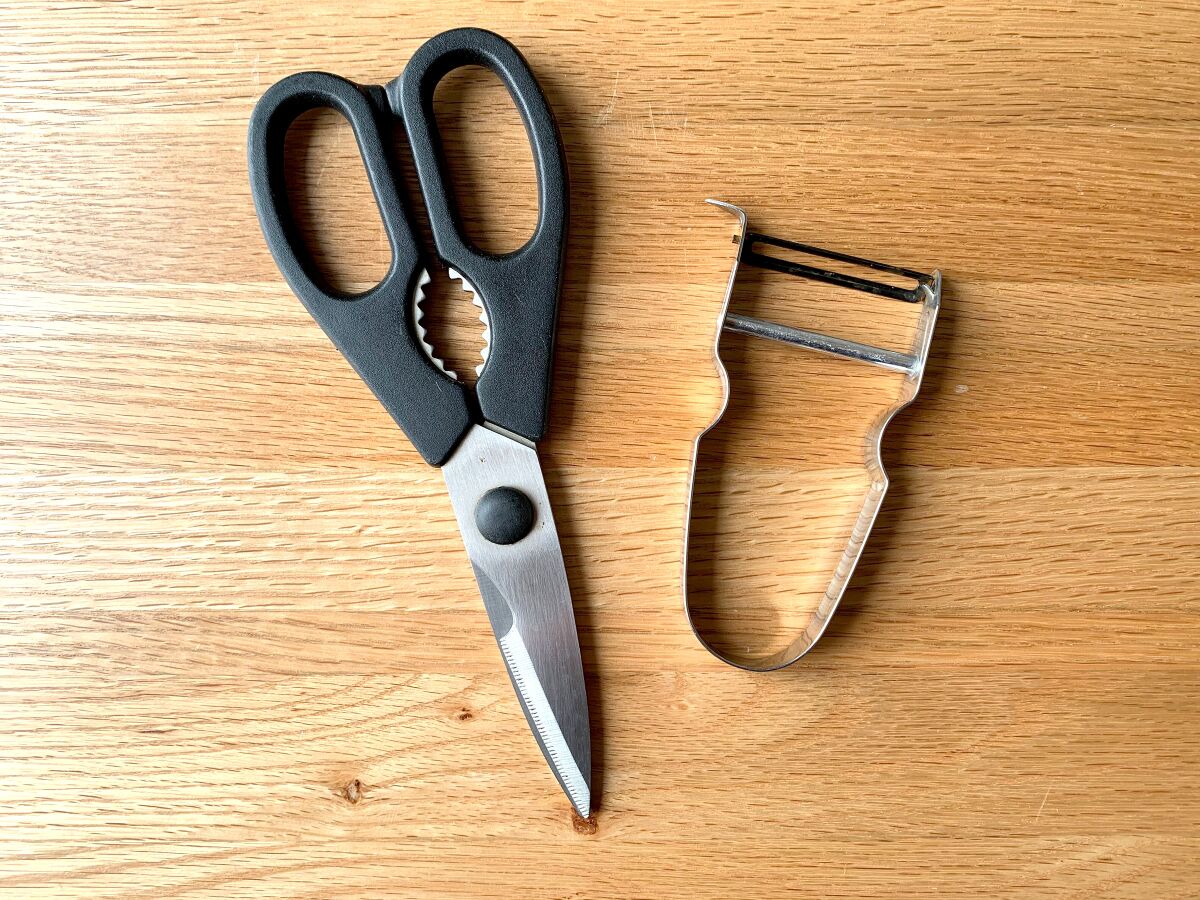 Kitchen shears and a Y-shaped vegetable peeler.
