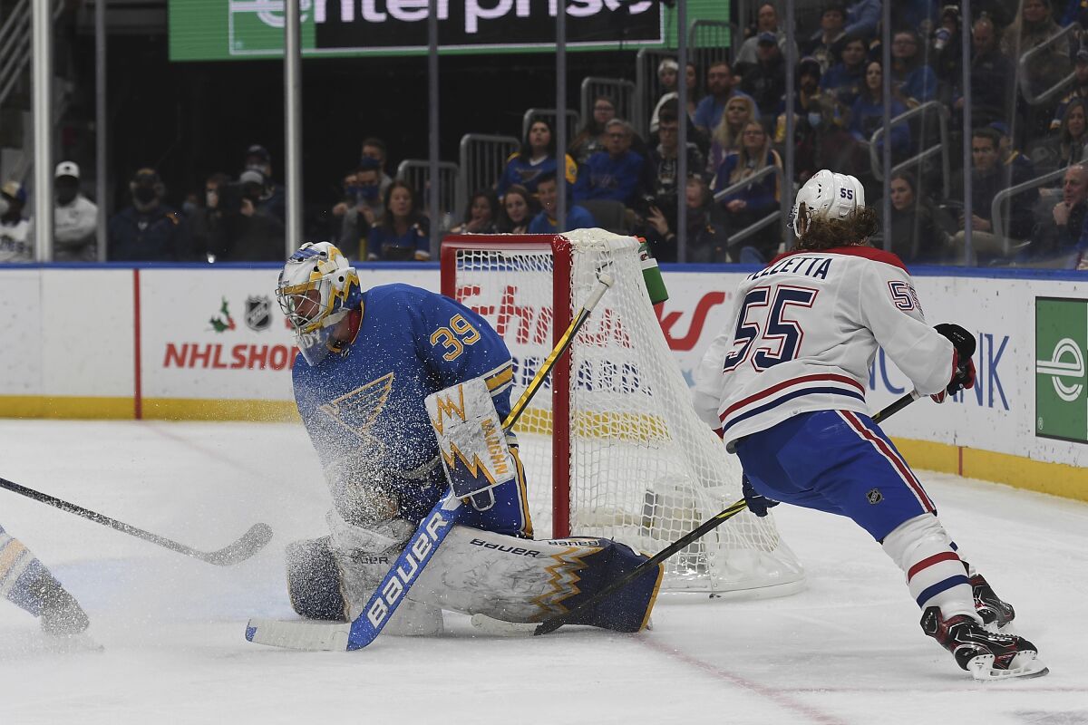 St. Louis Blues' Charlie Lindgren (39) makes a save during the first period of an NHL hockey game against the Montreal Canadiens, Saturday, Dec. 11, 2021, in St. Louis. (AP Photo/Michael Thomas)