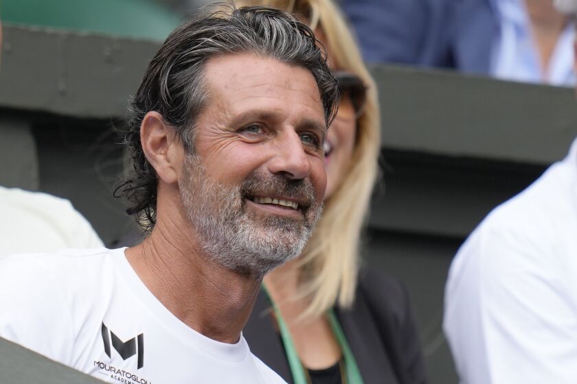 FILE - Tennis coach Patrick Mouratoglou watches a match at Wimbledon in London, Wednesday, July 6, 2022. A tennis league founded by Mouratoglou to play exhibition matches when the pro tours were shut down during the coronavirus pandemic plans to return in 2023 with four events. The Ultimate Tennis Showdown, or UTS, announced Thursday, Dec. 1, that it will hold matches in July, September, November and December in the United States, Europe, Asia and the Middle East.(AP Photo/Kirsty Wigglesworth, File)
