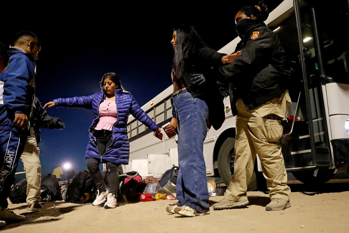 Migrants turn themselves over to U.S Border Patrol agents along the U.S.-Mexico border in Somerton, Ariz. 