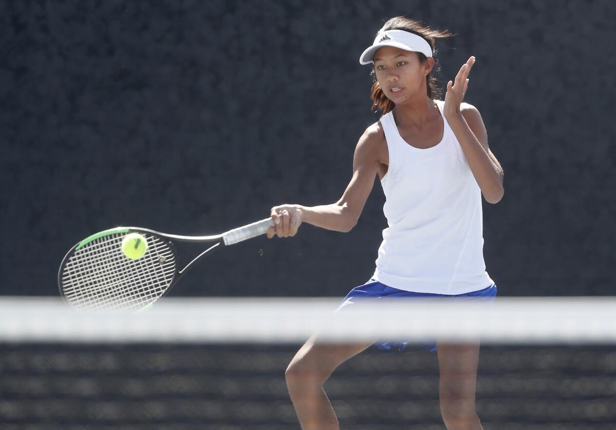 Fountain Valley's Nghi Trinh hits against Corona del Mar's Hannah Jervis in the singles semifinals of the Surf League tournament in Newport Beach on Wednesday.