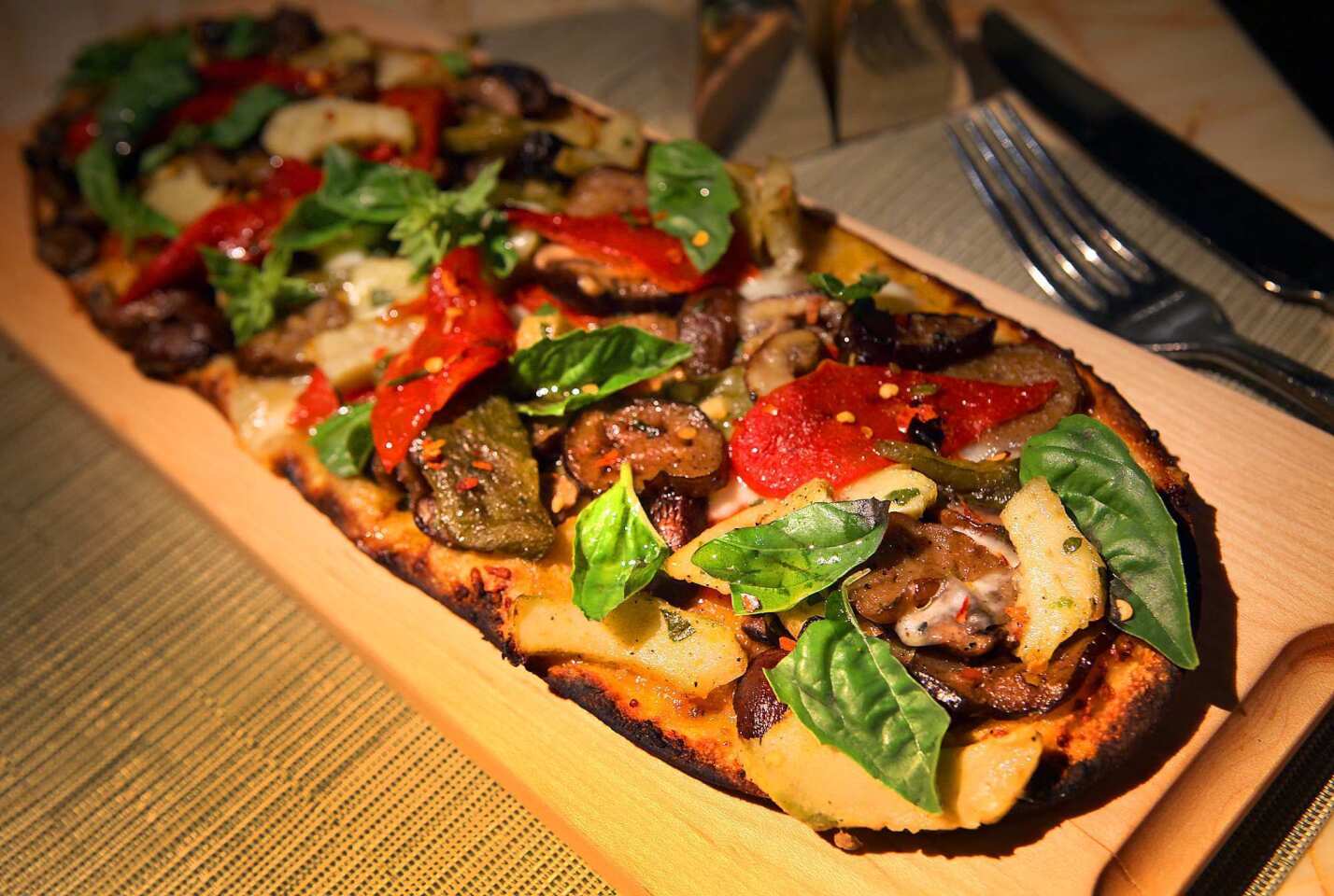 Behold the grilled vegetable flatbread at the Society Café at the Encore in Las Vegas: roasted artichokes, mushrooms, eggplant, peppers and vegan cheese.