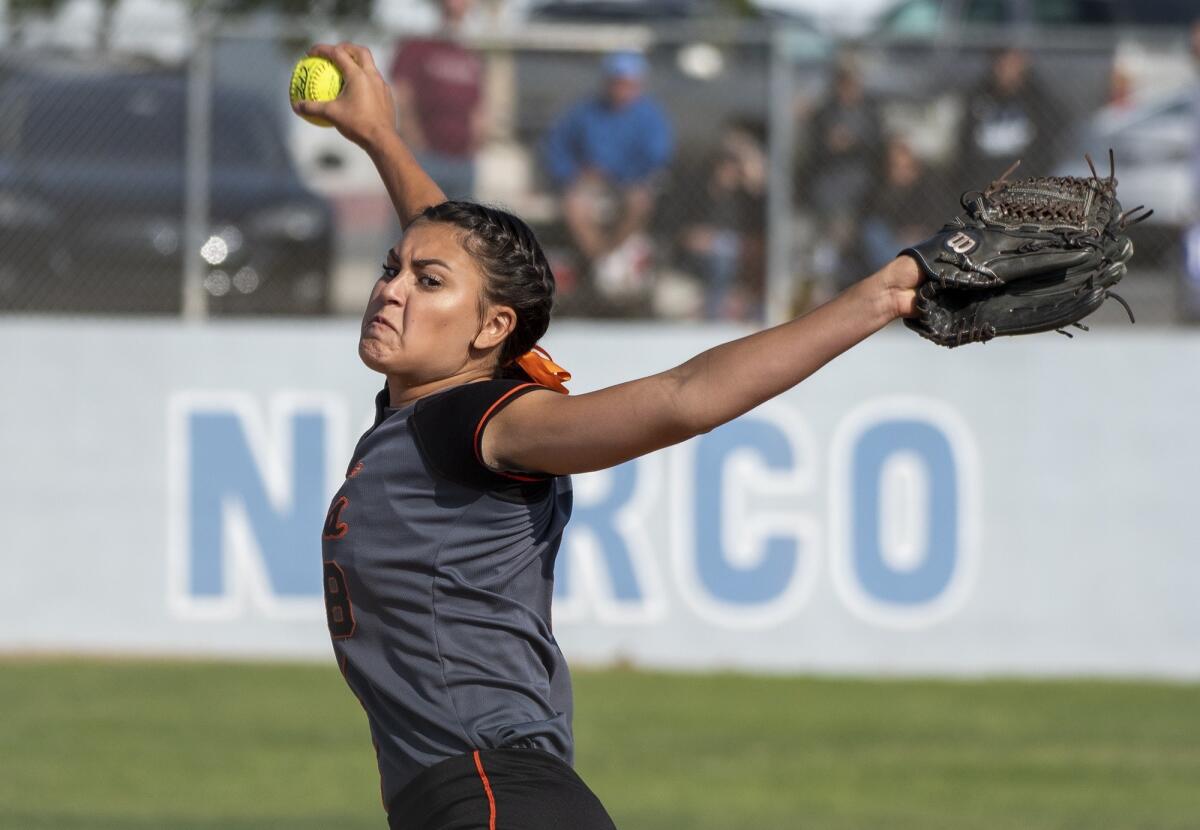 Huntington Beach High's Grace Uribe, pictured throwing a pitch at Norco on May 24, 2018, combined on a no-hitter with Morgan MacBeath Thursday.