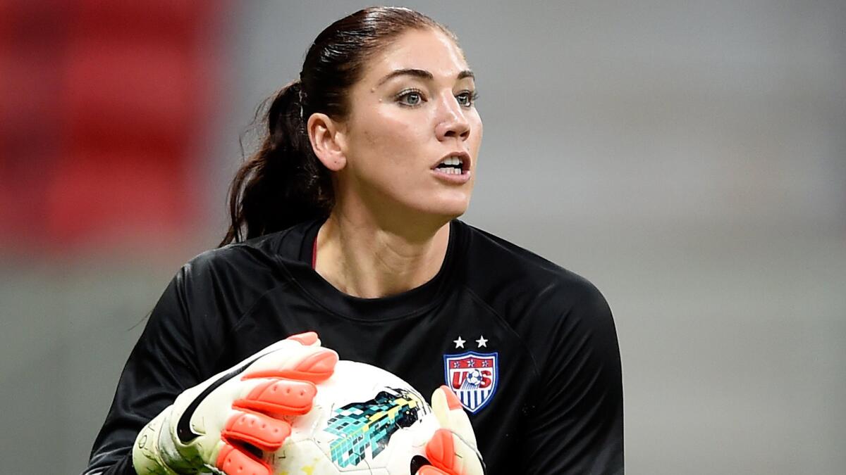 U.S. goalkeeper Hope Solo controls the ball during a match against China in Brazil on Dec. 10, 2014.