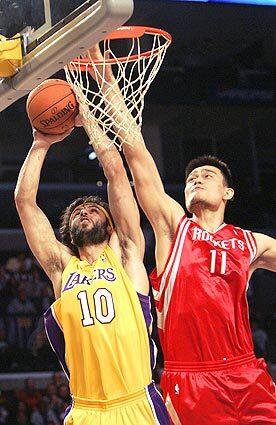 Laker's Vladimir Radmanovic has his shot blocked by Houston's Yao Ming at Staples Center.