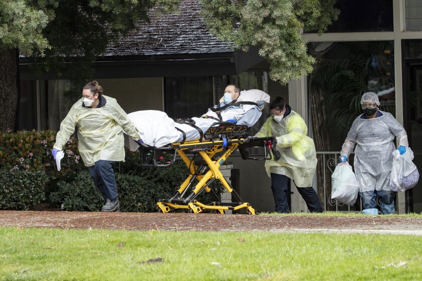 Patients are moved from the Magnolia Rehabilitation and Nursing Center in Riverside after staff failed to show up on April 7, 2020.