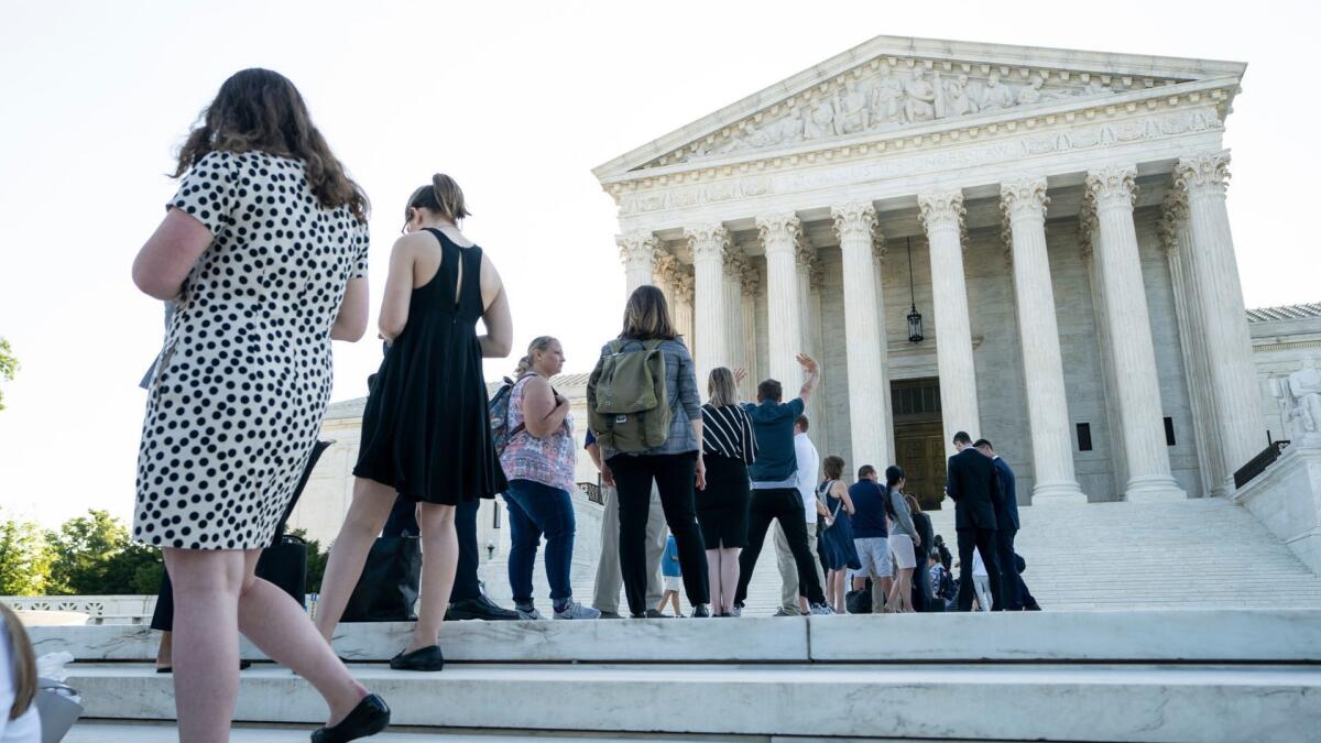 People line up outside the Supreme Court in Washington on June 26, 2019, the eve of the final day of its current session.