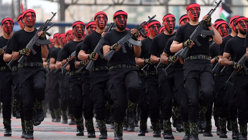 New members of the Palestinian Hamas security forces march as they take part in a graduation ceremony in Gaza City on March 30, 2017.