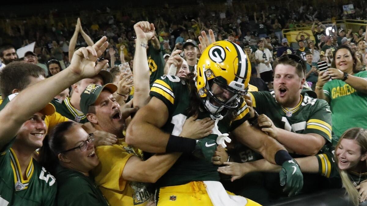 Equanimeous St. Brown celebrating a touchdown as a Packer in preseason.