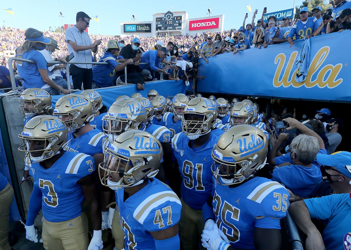 UCLA players prepare to take the field for a game against LSU.