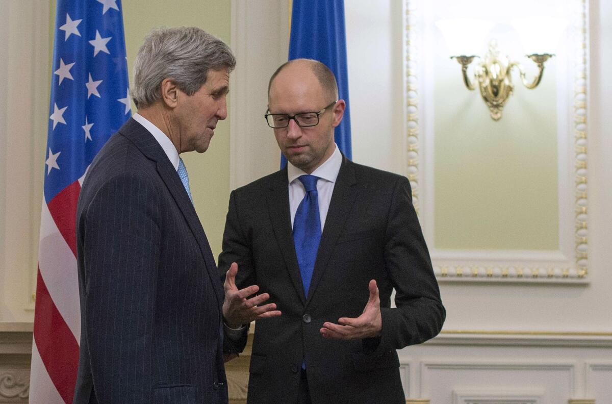 Secretary of State John F. Kerry, left, talks with Ukrainian Prime Minister Arseny Yatsenyuk in Kiev on Feb. 5.