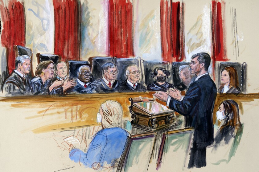 This artist sketch depicts Mississippi Solicitor General Scott Stewart, standing while speaking to the Supreme Court, Wednesday, Dec. 1, 2021, in Washington. Center for Reproductive Rights Litigation Director Julie Rikelman is seated right. Justices seated from left are Associate Justice Brett Kavanaugh, Associate Justice Elena Kagan, Associate Justice Samuel Alito, Associate Justice Clarence Thomas, Chief Justice John Roberts, Associate Justice Stephen Breyer, Associate Justice Sonia Sotomayor, Associate Justice Neil Gorsuch and Associate Justice Amy Coney Barrett. (Dana Verkouteren via AP)