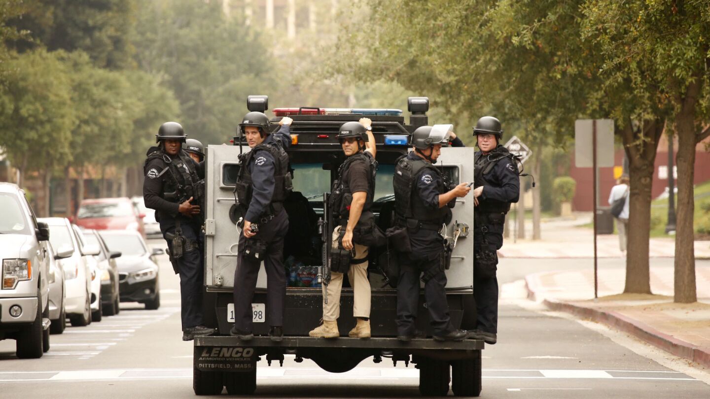 Police search the UCLA campus after a shooting Wednesday.