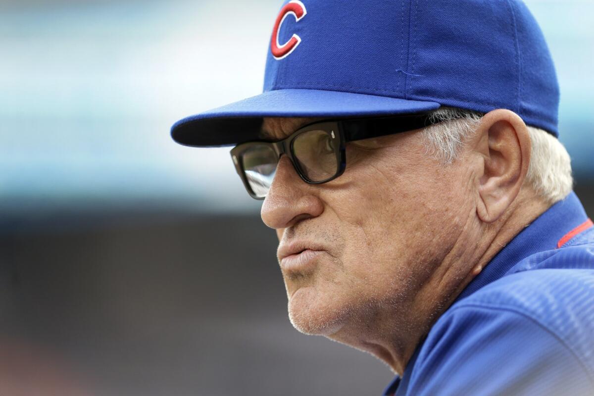 Chicago Cubs manager Joe Maddon looks out from the dugout during a game against the Tigers in Detroit on June 9.