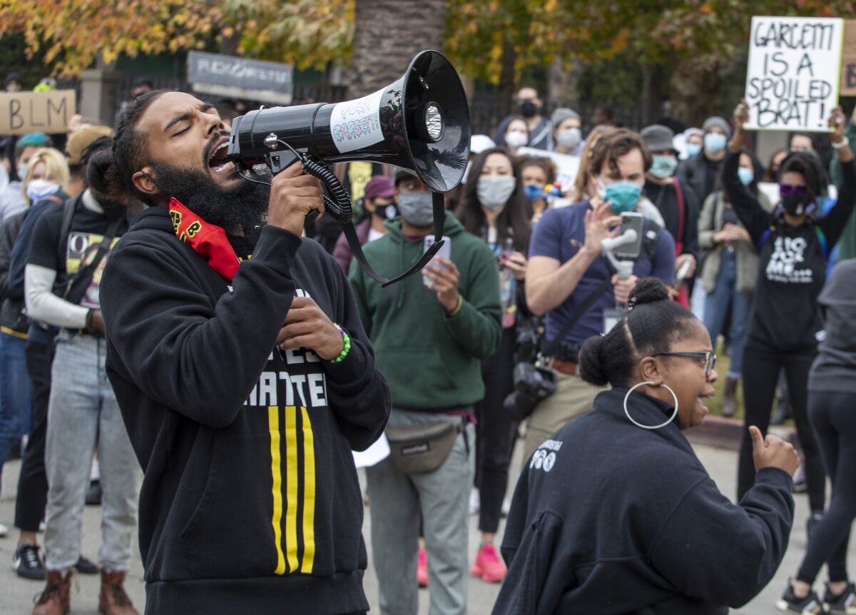 A protester holds a megaphone