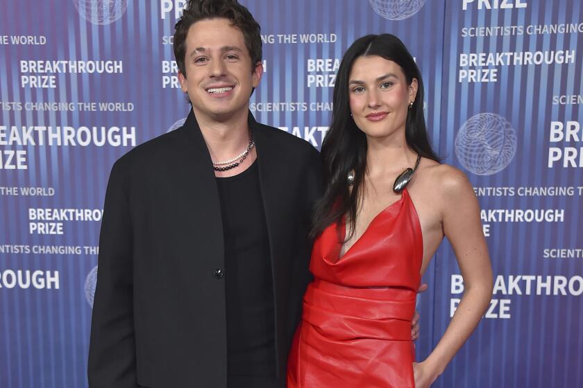 Charlie Puth, left, and Brooke Sansone arrive at the 10th Breakthrough Prize Ceremony on Saturday, April 13, 2024, at the Academy Museum of Motion Pictures in Los Angeles. (Photo by Jordan Strauss/Invision/AP)