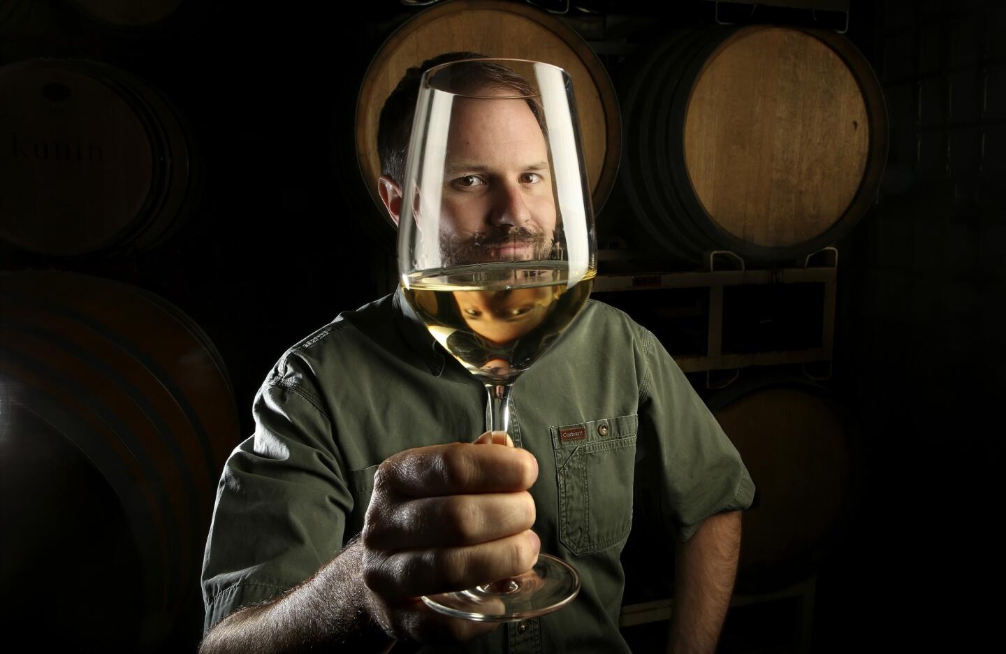 Winemaker Graham Tatomer checks out a glass of Riesling at Tatomer Wines in Santa Maria, Calif.