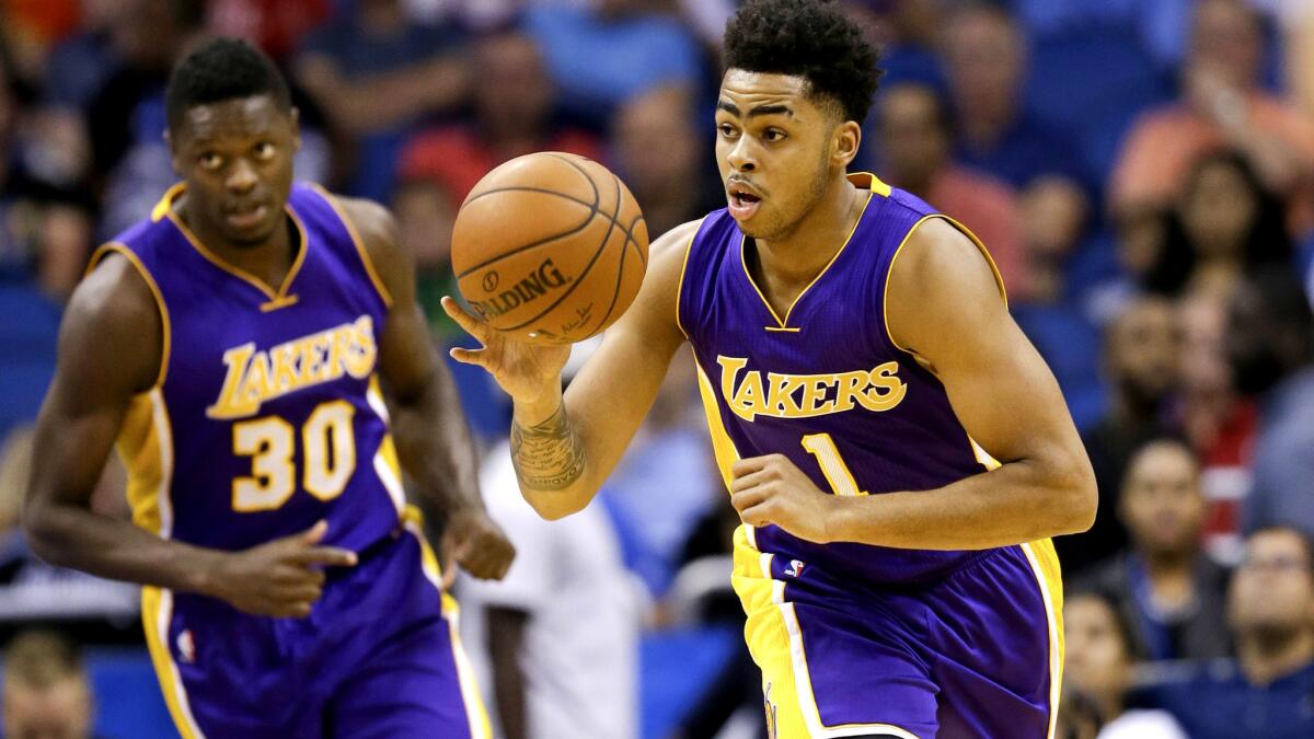 Lakers guard D'Angelo Russell (1) and forward Julius Randle (30), shown during a game last season, helped lead the charge at practice.
