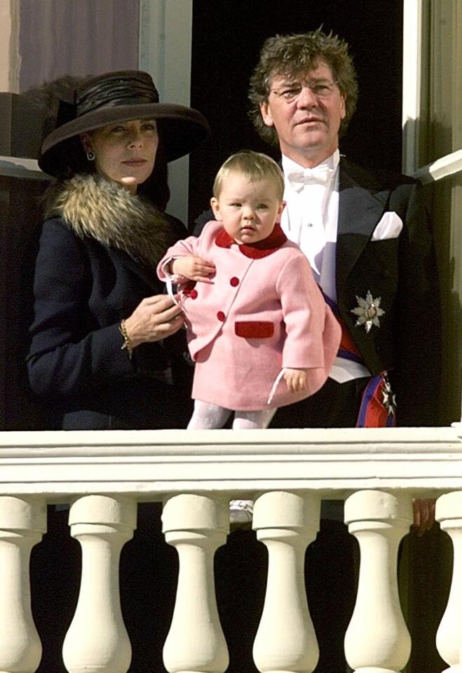 Princess Caroline of Hanover, her husband, Prince Ernst August of Hanover, and their daughter, Princess Alexandra, watch the Monaco National Day parade from a balcony of the Monaco Palace. Princess Alexandra, who has half siblings from both parents' previous marriages, is the granddaughter of Princess Grace of Monaco.