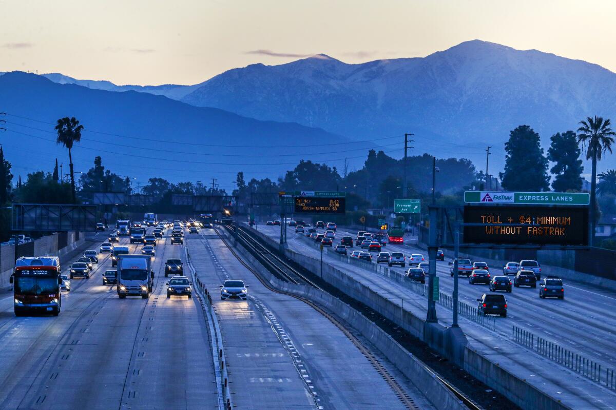 On the first day of Los Angeles County's "Safer at Home" order, traffic is light on Interstate 10. 
