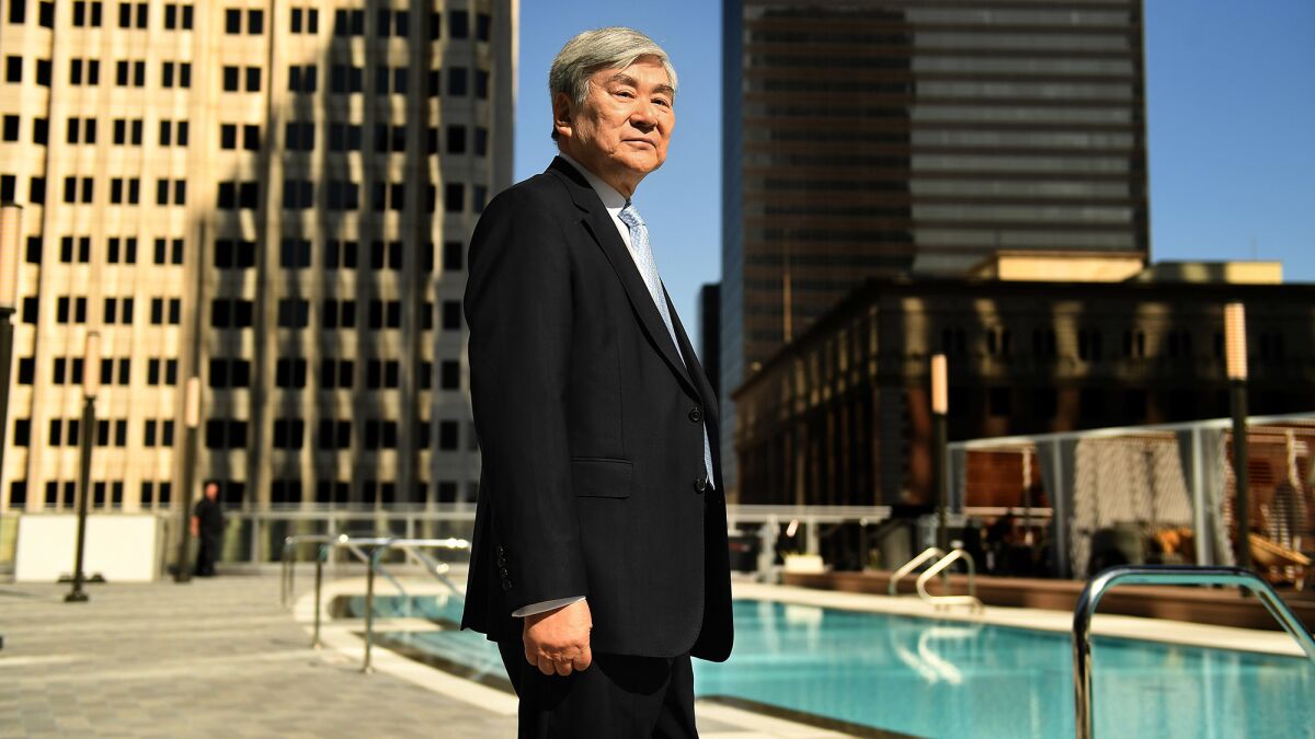 Yang Ho Cho, the man behind L.A.'s tallest building -- and the tallest building in the West -- stands next to the pool at the Wilshire Grand Center in downtown Los Angeles.